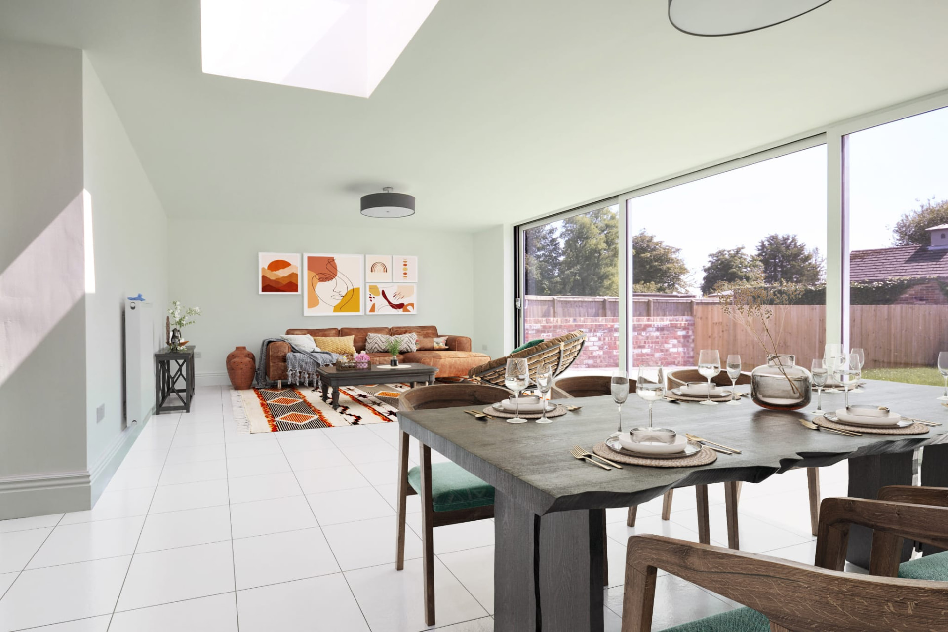 Finished open-plan dining and living space with rooflight and full-height glazing onto the garden