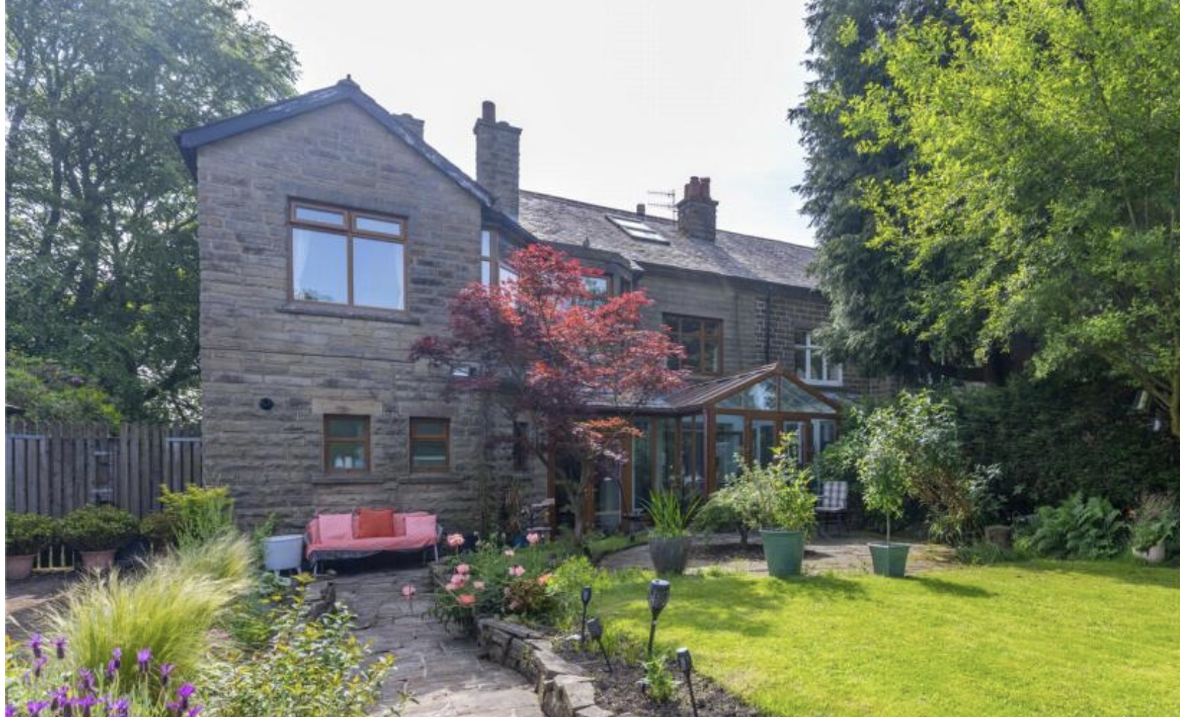 Stone semi-detached house with rear conservatory and landscaped garden in Rossendale
