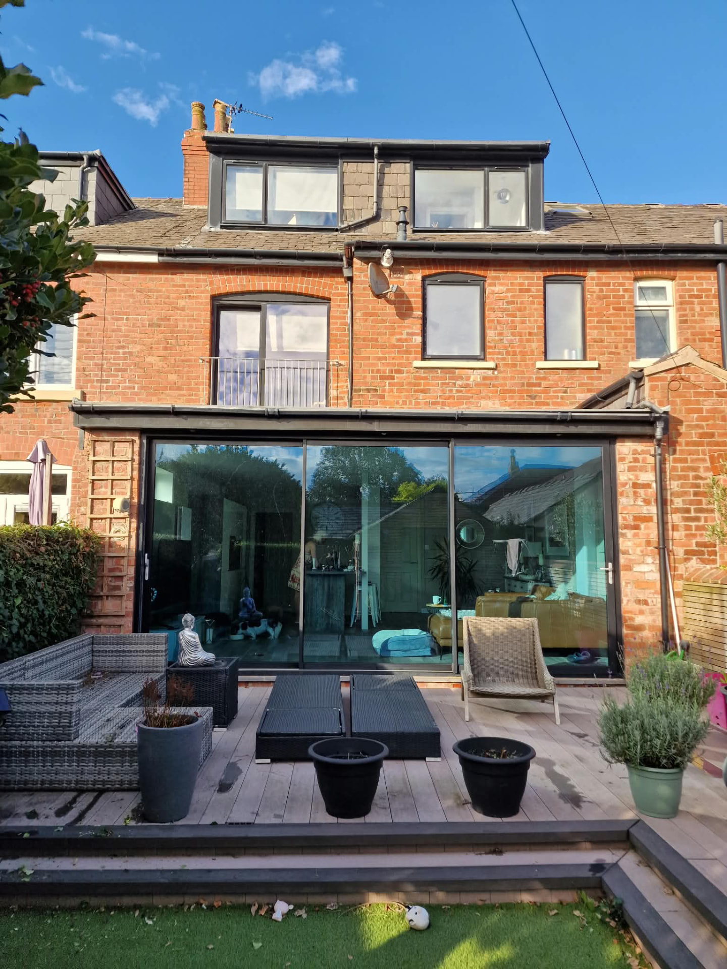 Rear brick extension with wide full-height glazing and a loft conversion on a terraced home in Lytham St Annes