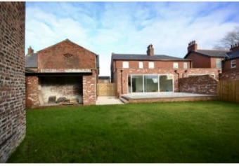 Chorley single-storey rear extension viewed across the lawn