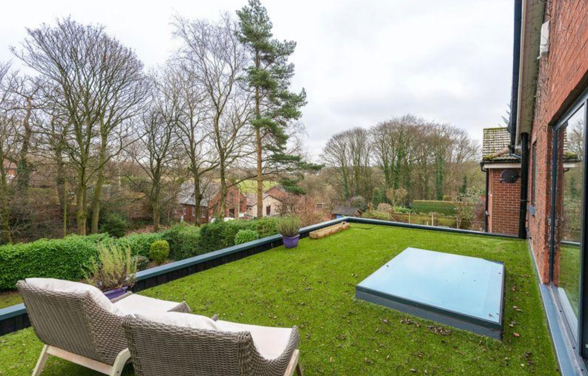 Garden with flush rooflight and countryside views beyond